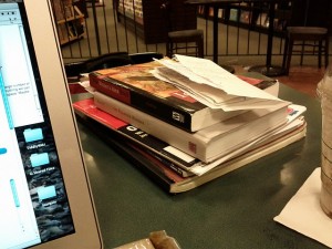 piles of notes between caffeine fuel and computational engine